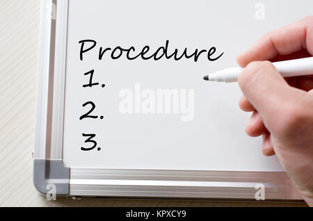 Procedure written on whiteboard Stock Photo