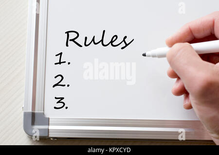 Rules written on whiteboard Stock Photo