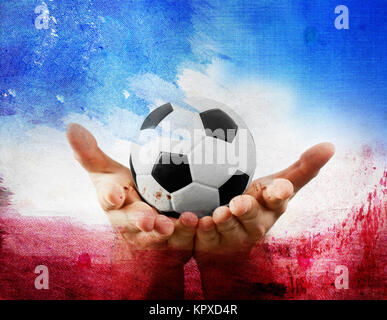 Hands holding football on France's flag colored background Stock Photo