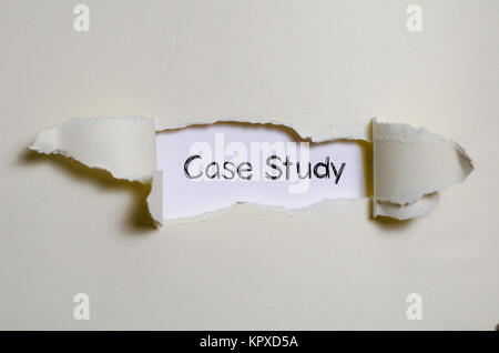 The word case study appearing behind torn paper. Stock Photo