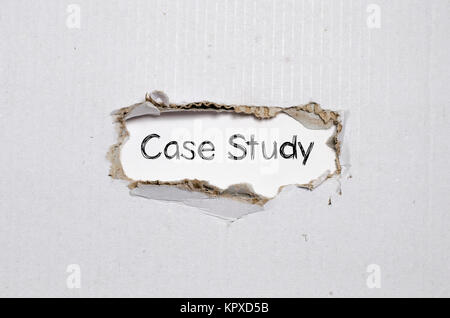 The word case study appearing behind torn paper. Stock Photo