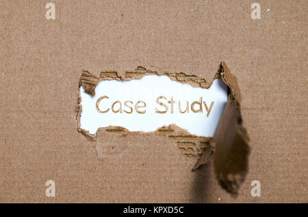 The word case study appearing behind torn paper. Stock Photo