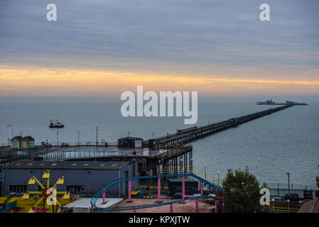Cold frosty and misty morning in Southend on Sea as people take the train to the end of Southend pier. Sunrise. Stock Photo