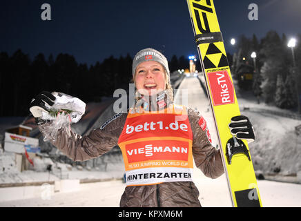 Hinterzarten, Germany. 17th Dec, 2017. Maren Lundby from Norway celebrating her victory at the FIS Ladies Ski Jumping World Cup in Hinterzarten, Germany, 17 December 2017. Credit: Felix Kästle/dpa/Alamy Live News Stock Photo