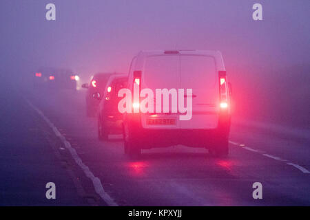 Southport, Merseyside. Dense Fog. 18th December 2017. UK Weather. Commuters on their way to work were met by very difficult driving conditions this morning as a blanket of dense fog descended along the north west coastline at Southport in Merseyside. Credit: Cernan Elias/Alamy Live News Stock Photo