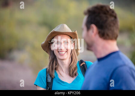 Smiling Woman on Nature Hike Stock Photo