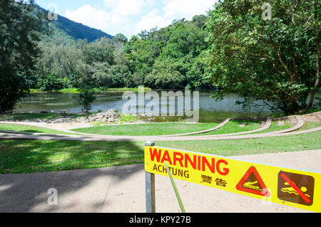Crocodiles warning sign, no swimming, at Lake Placid, Cairns, Far North Queensland, FNQ, QLD, Australia Stock Photo