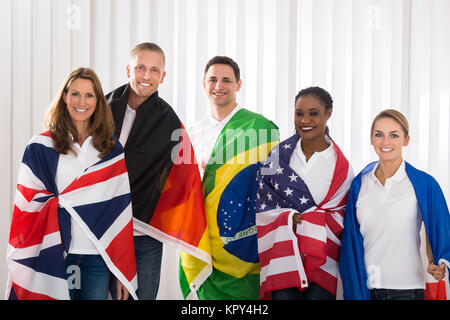 Friends With Flags From Different Countries Stock Photo