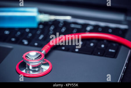 Stethoscope on laptop Stock Photo