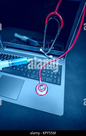 Stethoscope on laptop Stock Photo