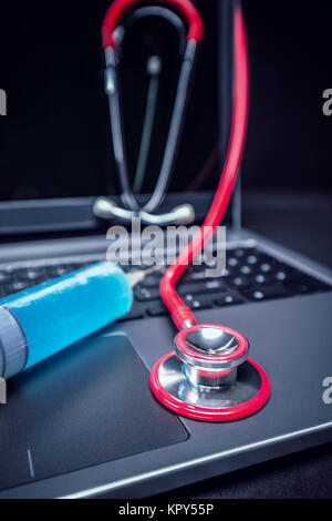 Stethoscope on laptop Stock Photo