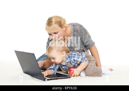 Happy family with notebook. Stock Photo