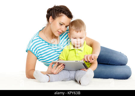 Happy family with computer tablet. Stock Photo