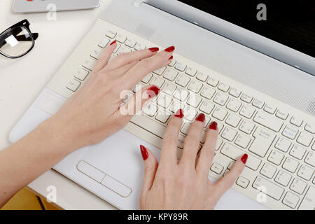 woman office worker typing on the keyboard Stock Photo
