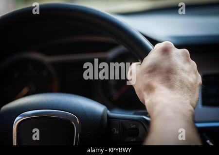 Hands on steering wheel Stock Photo