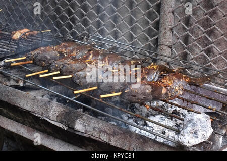 Grill cat fish on hot charcoal stove Stock Photo