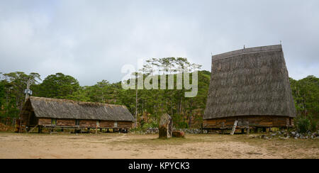 Traditional houses at an ethnic village in Central Highlands, Vietnam. Stock Photo