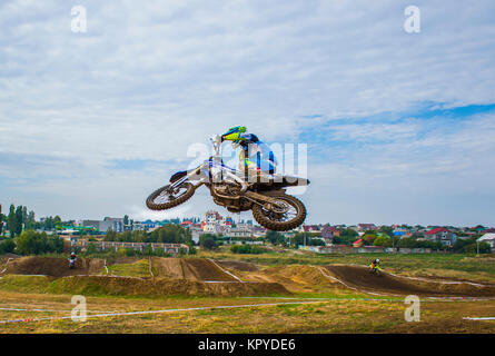 A motorcycle rider participates in a motocross race. Jumps on the trampoline. Close-up. Extreme sport. Sport games Stock Photo