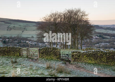 Kissing gate at Twenty trees on hillside above the village of Hayfield, Derbyshire on a frosty winter morning. Stock Photo