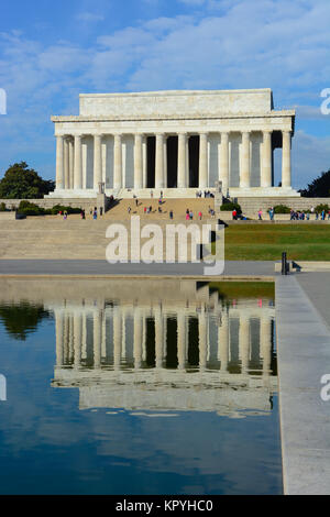 Portrait view of the Lincoln Memorial and reflection in the Reflecting Pool, Washington DC, USA on a sunny warm day with blue sky light clouds Stock Photo