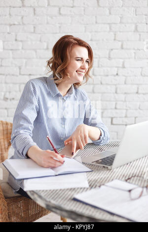 Modern happy business woman in the office Stock Photo