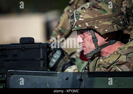 Tech. Sgt. Brian Bond, 823d Base Defense Squadron fireteam member, aims before firing a .50 Caliber M2 machine gun during a heavy weapons qualification, Dec. 13, 2017, at Camp Blanding Joint Training Center, Fla. Airmen shot at targets with the M2 to maintain their proficiency and familiarize themselves with the weapon. (U.S. Air Force Stock Photo