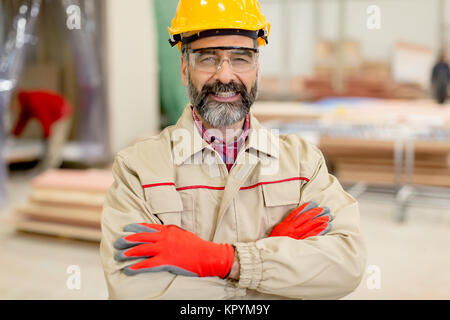 Portrait of middle-aged engineer in factory Stock Photo