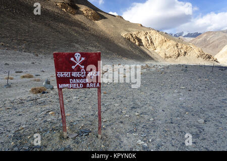 Red attention sign, Danger minefield area, in the barren landscape n the disputed area on sino-indian border, Ladakh, Jammu and Kashmir, India. Stock Photo