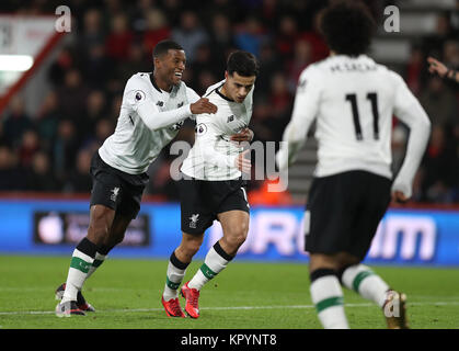 Liverpool's Philippe Coutinho (centre) celebrates with his team-mates after scoring his side's first goal during the Premier League match at the Vitality Stadium, Bournemouth. Stock Photo
