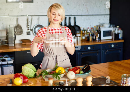 Woman Taking Photo of Ingredients Stock Photo