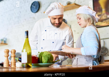 Chef Working in Cafe Kitchen Stock Photo