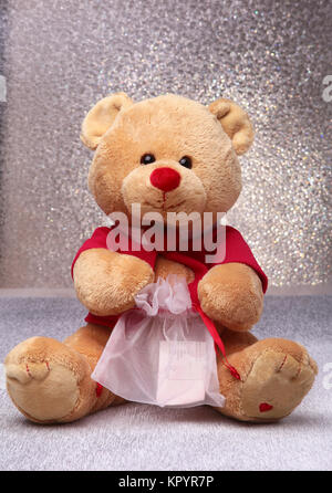 Teddy bear sitting on a white background Stock Photo