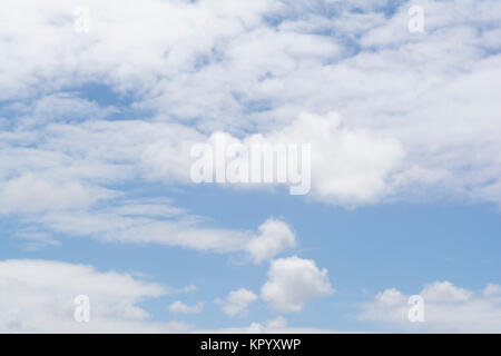 Puffy soft white cloud formations showing a good amount of pale blue sky behind it. The type you get on a nice day when it's not too hot or cold. Suit Stock Photo