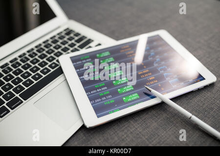 Digital tablet showing charts and diagram Stock Photo