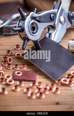 Brass leather awl punch kit with various tipped needles top down view Stock  Photo - Alamy