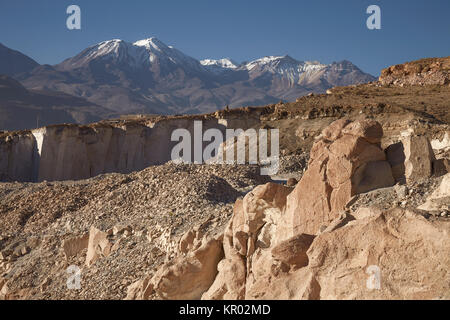 Sillar Stone Quarry and volcano Chachani in Arequipa Peru Stock Photo