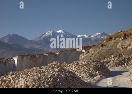 Sillar Stone Quarry and volcano Chachani in Arequipa Peru Stock Photo