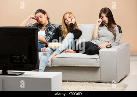 Scared teenage watching movies Stock Photo