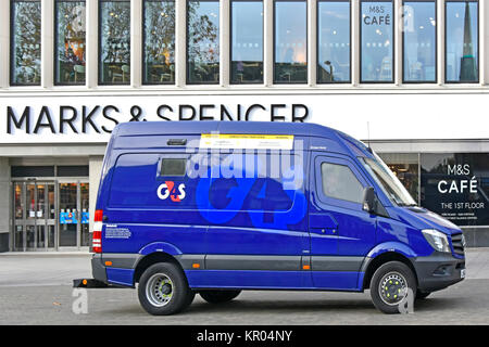 G4S blue money delivery tracked high security van parked outside Marks and Spencer store in High Street Brentwood Essex England UK