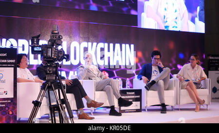 DUBAI, UAE - OCTOBER 12, 2017: World blockchain, Speakers Giving a Talk at Business Meeting. Audience in the conference hall. Business and Entrepreneurship. Speakers at Business Conference and Presentation Stock Photo
