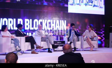 DUBAI, UAE - OCTOBER 12, 2017: World blockchain, Speakers Giving a Talk at Business Meeting. Audience in the conference hall. Business and Entrepreneurship. Speakers at Business Conference and Presentation Stock Photo