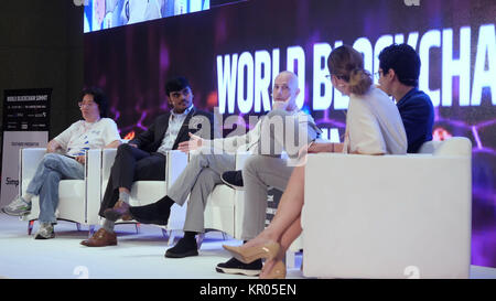 DUBAI, UAE - OCTOBER 12, 2017: World blockchain, Speakers Giving a Talk at Business Meeting. Audience in the conference hall. Business and Entrepreneurship. Speakers at Business Conference and Presentation Stock Photo