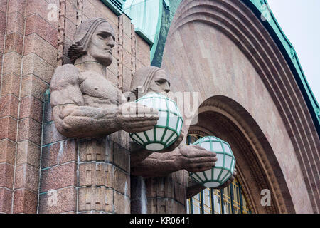 Statues with spherical lamps at Helsinki Central Station (Helsingin paarautatieasema), main station for commuter rail and long-distance trains departi Stock Photo
