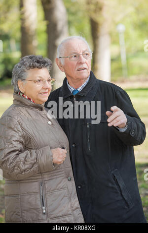 Elderly couple in the woods Stock Photo