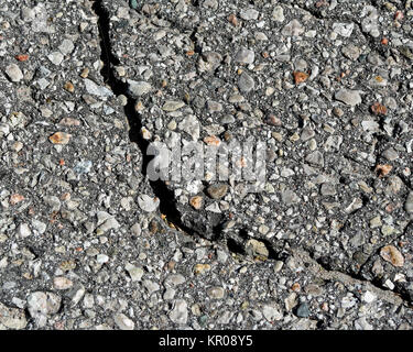 Paved asphalt surface with huge crack Stock Photo