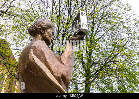 Monument to Marie Sklodowska Curie representing her discovery of Polonium (named after her homeland of Poland), a chemical element with atomic number  Stock Photo