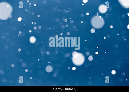 Falling snow on black background. Beautiful winter holiday background for Christmas ideas Stock Photo