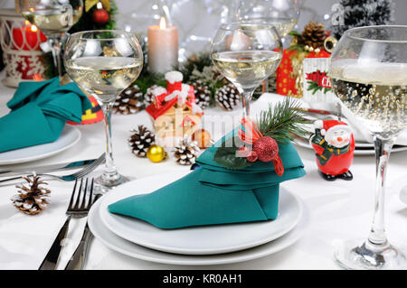 Napkin folded in the form of an Elven boot decorated on the Christmas table Stock Photo