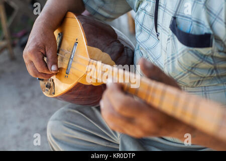 Man playing Tatar instrument Stock Photo