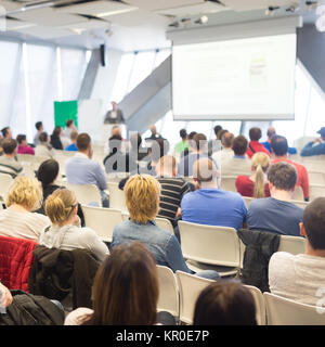 Male speeker having talk at public event. Stock Photo